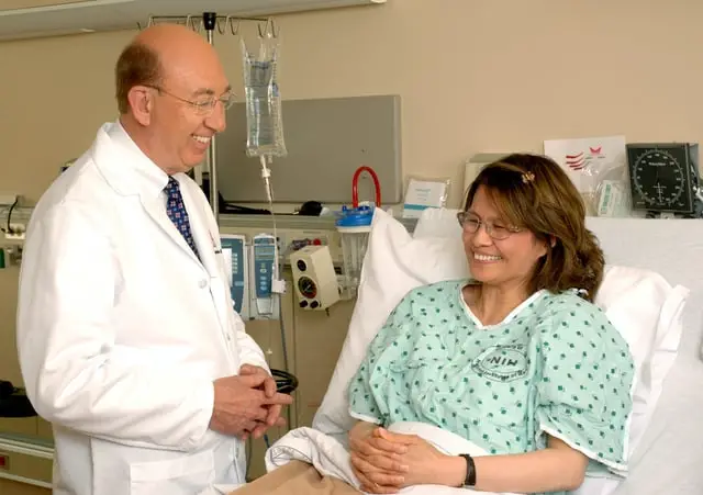 Anesthesiologist with patient after surgery 